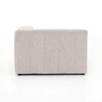 Side profile of sectional illustrating low height and cushioned vertical channel backrest