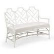 White rattan curved bench with geometric lattice back and upholstered white seat cushion