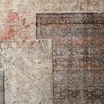 Top-down view showing overlapping Elio Oriental Gray Black rug and a rug with lighter colors and patterns