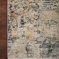 Corner of Axel Rug on dark hardwood floor highlighting edge finish and color blending