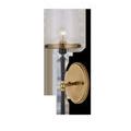 Lyndall Wall Sconce with antique brass oval wall plate and clear glass shade over a visible bulb