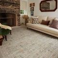 Ida Spa rug styled in living room setting with beige sofa and brick fireplace