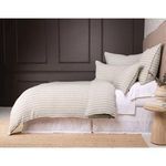 Blake duvet cover and shams styled against dark charcoal paneled wall with natural wood nightstand and jute rug