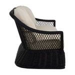 Side profile highlighting the woven frame's diamond pattern and cushion thickness on Soho Woven Sofa