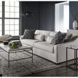 Archer Chairside Table in modern living room setting beside sofa with patterned pillows and textured rug