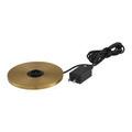 Round brass charging base with black power cord and plug viewed from angled side