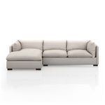 Front view repeated to show smooth stone fabric upholstery and plush cushions with espresso legs