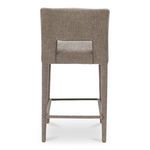 Back view highlighting carved lower backrest cutout and upholstery texture on Joyce counter stool