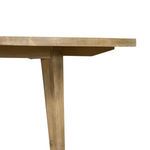 Side close-up showing tabletop thickness and texture of natural acacia wood