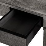 Opened center drawer revealing black interior contrasting the gray hair-on-hide exterior