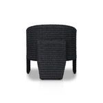 Wicker frame and cushion visible from low frontal angle showing seat thickness