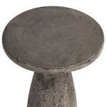 Top-down view highlighting the round table surface and curved base with dark gray textured finish