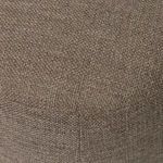 Closer view of ottoman fabric stitching and weave pattern highlighting corner seam
