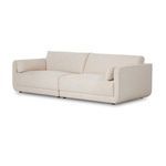 Left angled view of sectional showing clean lines and continuity of basketweave fabric