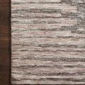 Corner close-up showing architectural pattern in blush and taupe near wood floor