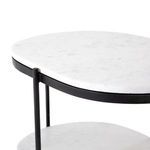 Top shelf of Felix Oval Nightstand with focus on edge curvature and connection to iron vertical rods