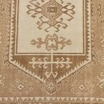 Top view close-up focusing on the central geometric medallion and fine details of the rug’s pattern