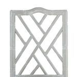 Close-up of the chair’s upper backrest geometric bamboo frame with carved limed oak texture