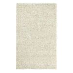 Handwoven jute area rug in neutral ivory tones with thick braided texture and natural fiber weave