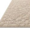 Close-up angled side view showing the rug’s textured high and low loop wool and cotton pile