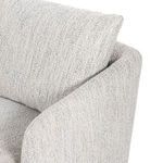 Top-down close-up showing seat cushion surface and angled armrest shape