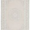Gray and white modern area rug with a global-inspired medallion center and scrolling border, soft high-low texture