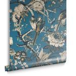 Single roll of Perrow Wallpaper with blue background and gold-accented bird and flower pattern