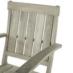 Close-up on the slatted back and armrest of teak lounge chair frame