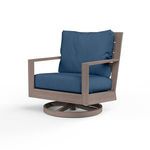 Laguna Swivel Club Rocker outdoor chair with driftwood-look aluminum frame and navy blue cushions