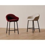 Two Emily counter stools in wine velvet and light beige fabrics showcased in a room with wood floor