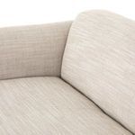 Side angle highlighting Ella Sofa's leather straps secured with handcrafted fastens