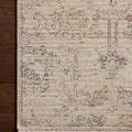 Detailed overhead view of Milena rug’s botanical pattern and finely finished edges on hardwood floor