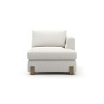 Front view showing wide seat cushion, supportive back cushions, and oak block feet detail