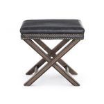 Focus on side of Elyse Ottoman showing sturdy dark wood framing with crossed legs detail