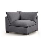 Three-quarter angle showing corner section with soft cushions from opposite side
