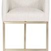 Ian Performance Metal Barrel Base Stool in brass with curved beige upholstered seat and armrests on a sleek metal barrel-s...