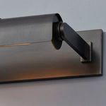 Side view highlighting adjustable arm and circular shade end