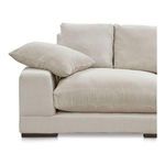 Close-up on left armrest and cushions, displaying corduroy fabric texture and cushion tufting