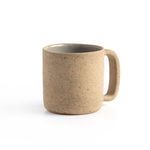 Single natural speckled clay mug front view showing shape and handle