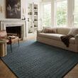 Bradley Teal Rug laid in sunlit living room with beige sofa and wood floor