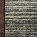 Corner section of Bellamy Lagoon Rug on dark wood floor showcasing edge finish and striped pattern in close detail