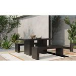Aurelius outdoor dining table styled with matching benches on a patio with plants and decorative rug