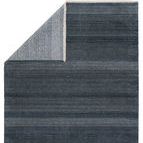 Backside folded corner revealing the power-loomed construction in blue and ivory