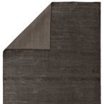 corner flip revealing reverse side with vertical ridged stripes in lighter and darker shades of gray