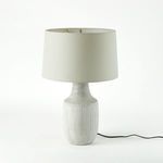 Lamp with power cord on white background, shade appears brighter with visible fabric texture.