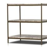 Partial angled close-up of nightstand frame and marble shelves focusing on frame detailing