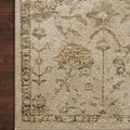 Close-up top-down view revealing the rug’s plush texture and warm color variations on a dark wood floor