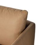 Tight stitching detail at the junction of seat cushion and armrest leather