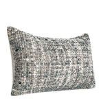 Angled front view emphasizing the woven multi-fiber pattern and pillow shape