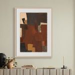 Abstract painting hanging on beige wall above decorative mantel with pottery and books
